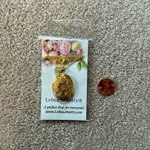 New gold locket, penny for size reference (not included)